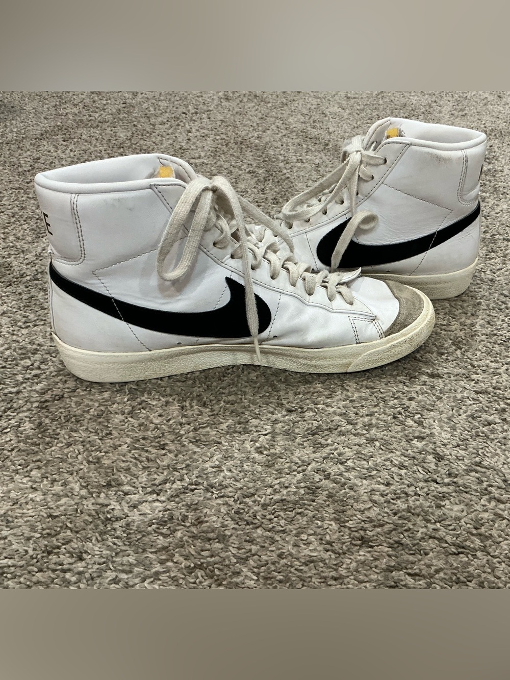 Nike White High-Top Sneakers with Black Swoosh